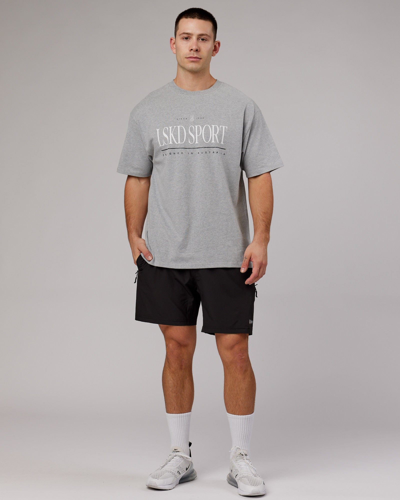 Model wearing Unisex Heritage Heavyweight Tee Oversize - Lt Grey Marl