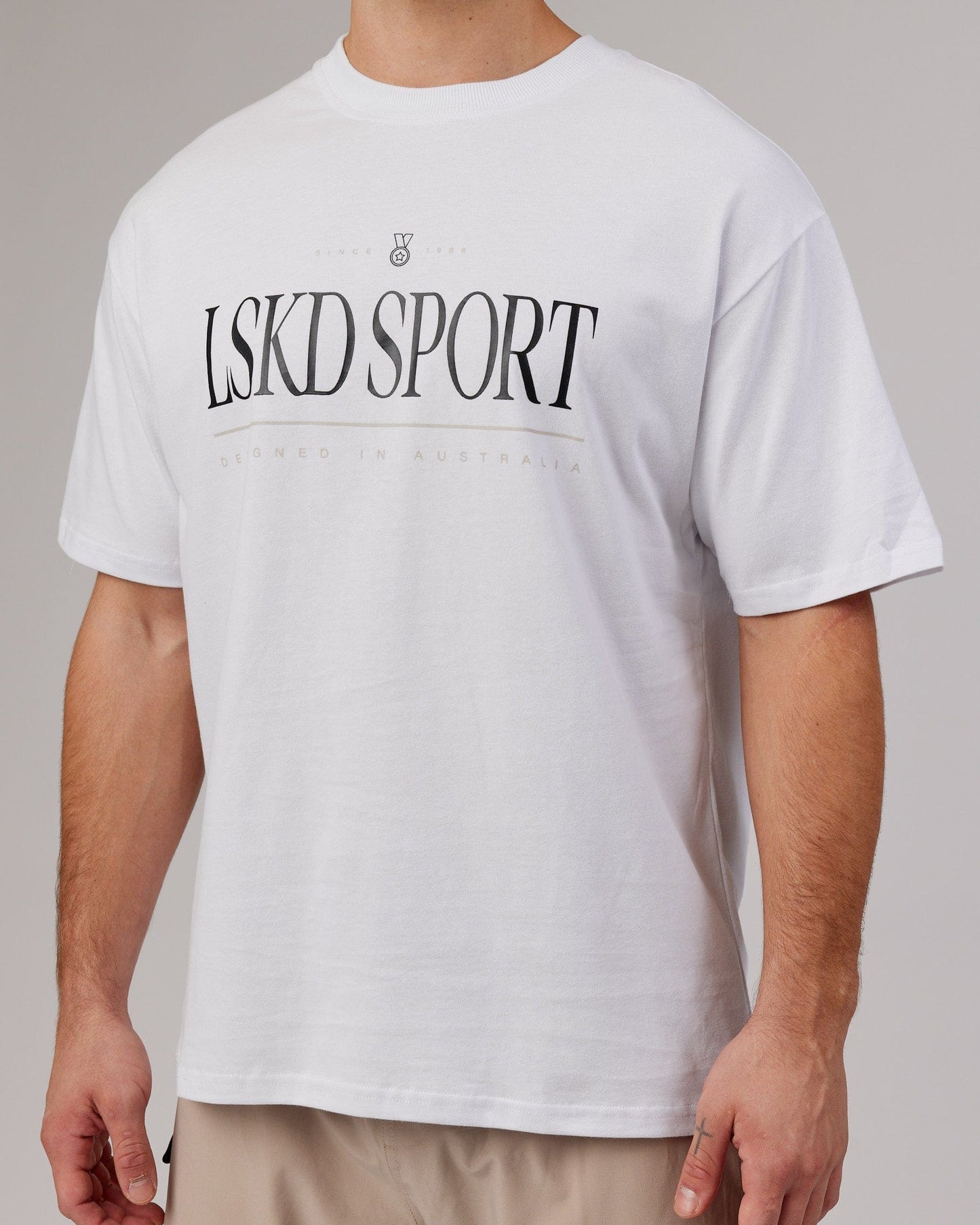 Model wearing Heritage Heavyweight Tee Oversize - White-Black-Oak