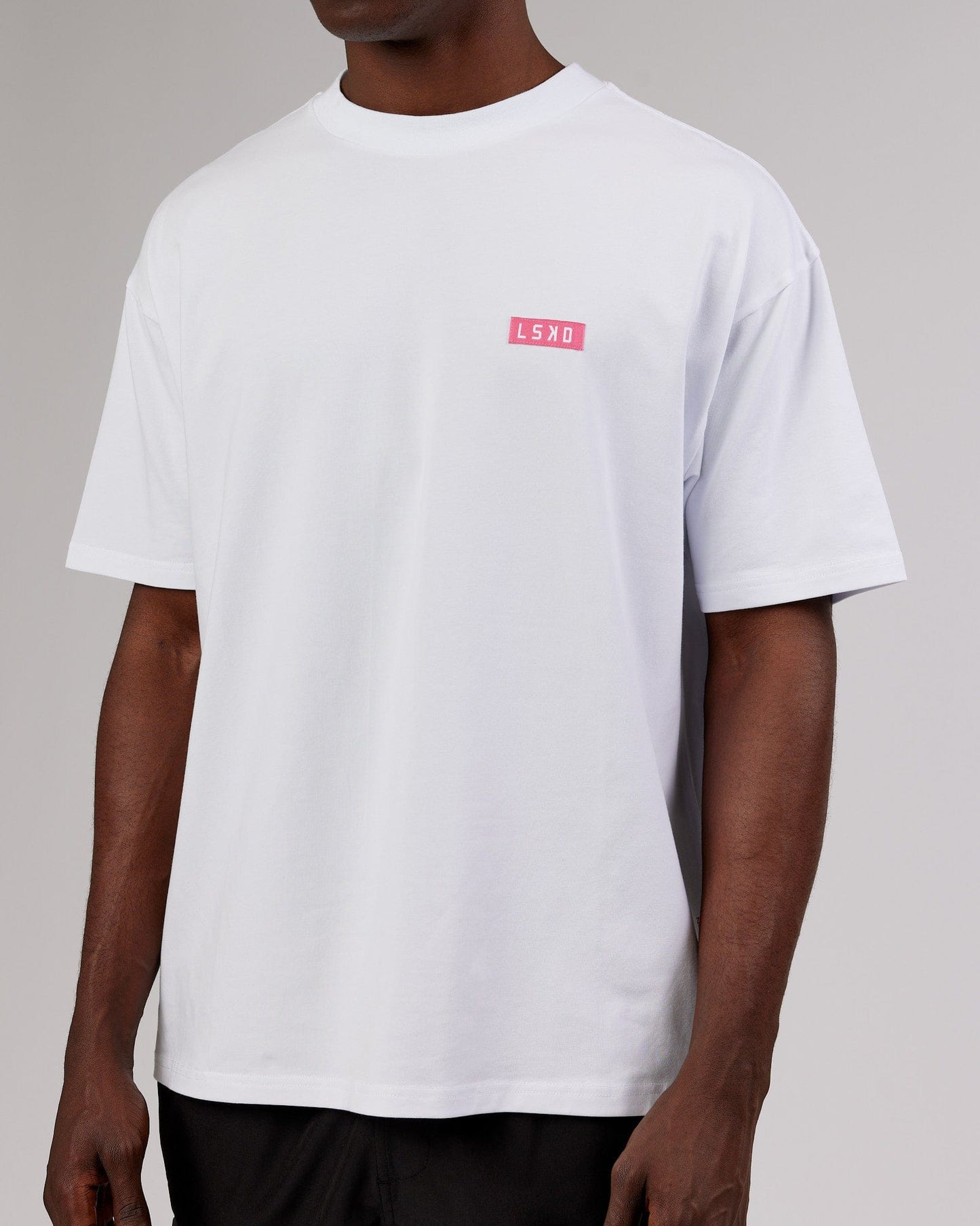Model wearing Iconic FLXCotton Tee Oversize - White-Pink
