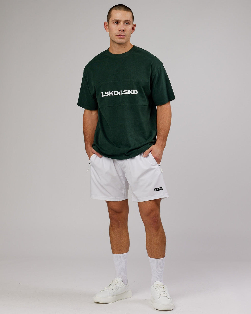 Model wearing Unisex Impact Heavyweight Tee Oversize - Forest