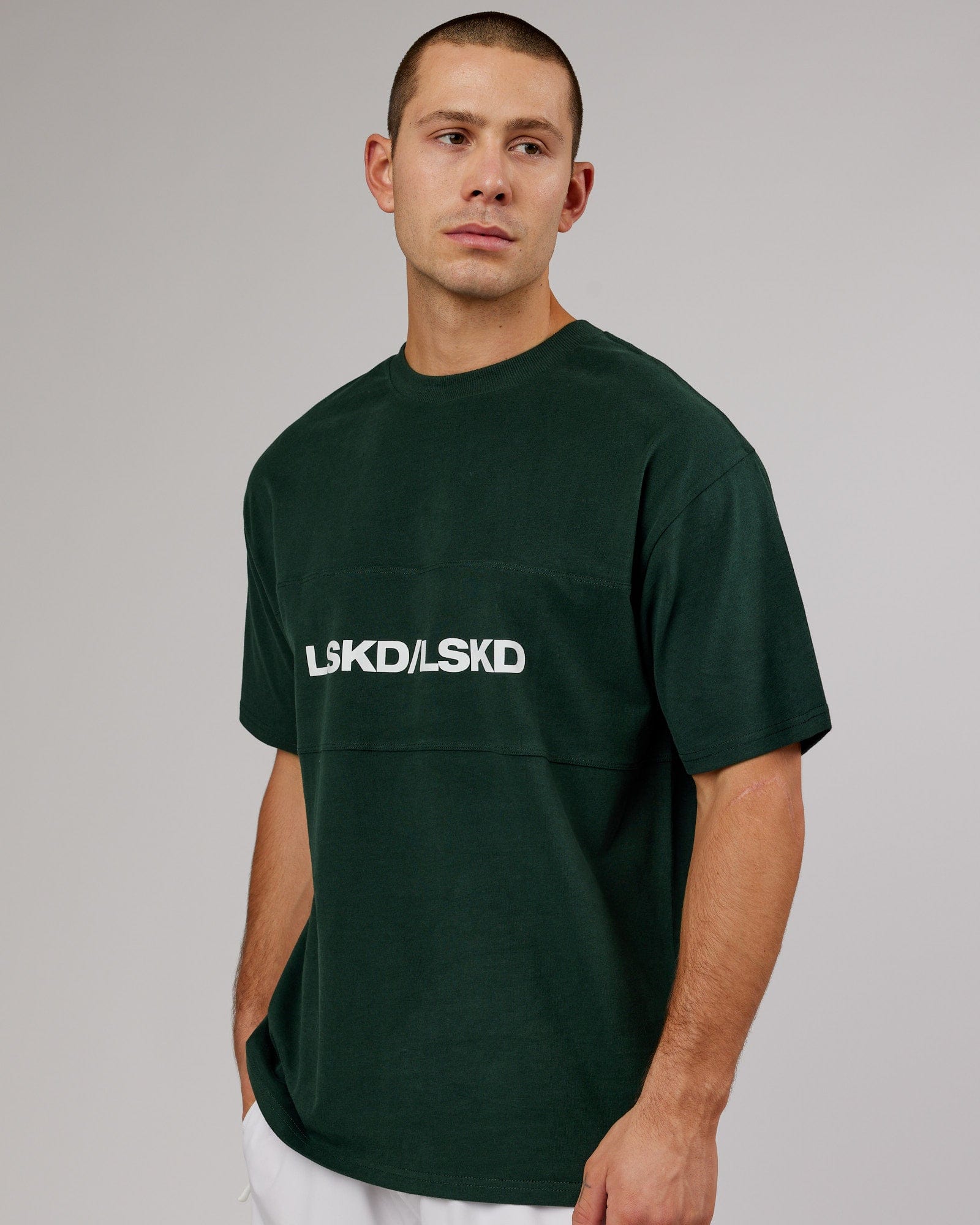 Model wearing Unisex Impact Heavyweight Tee Oversize - Forest