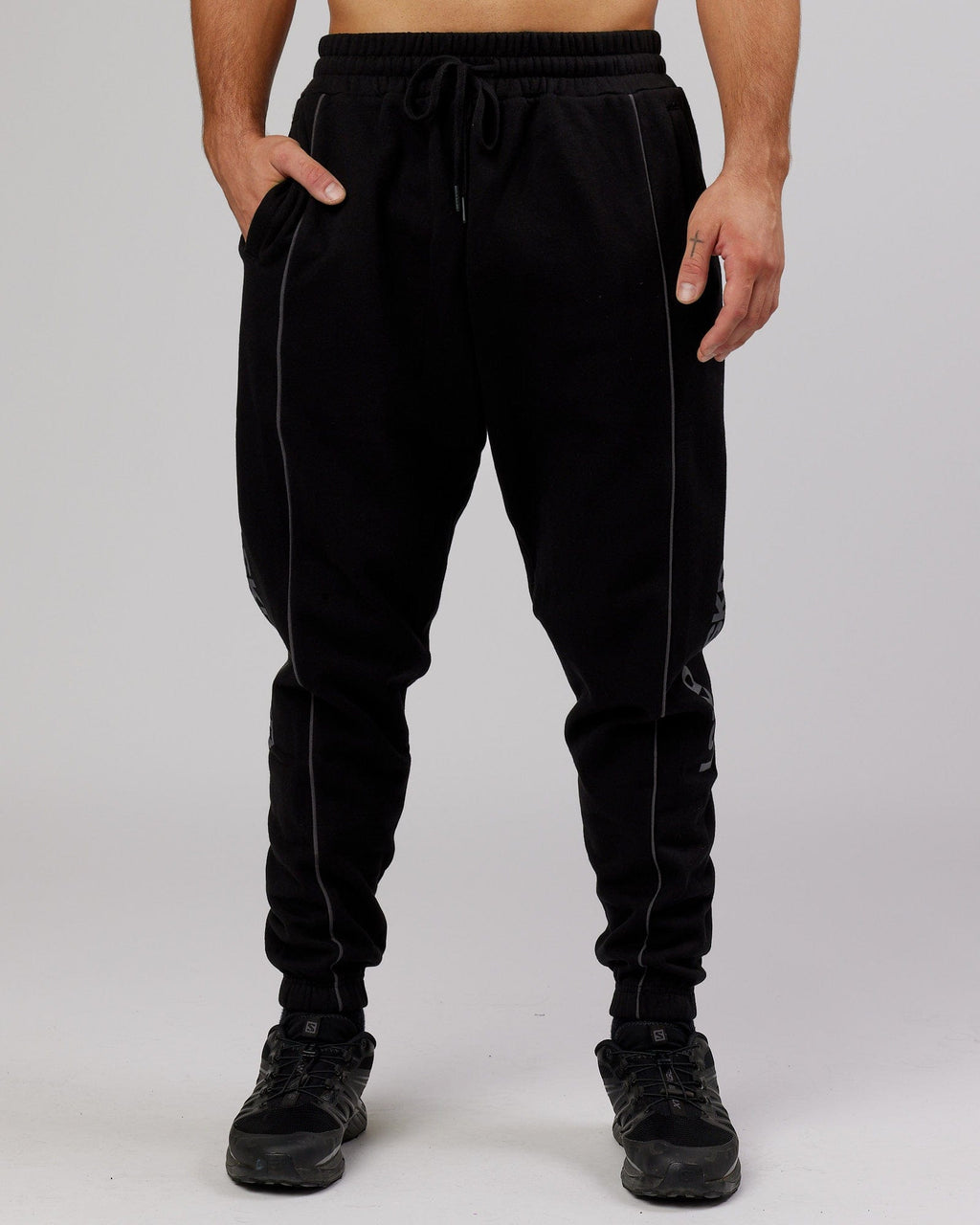 Model wearing Impact Trackpants - Black-Grey