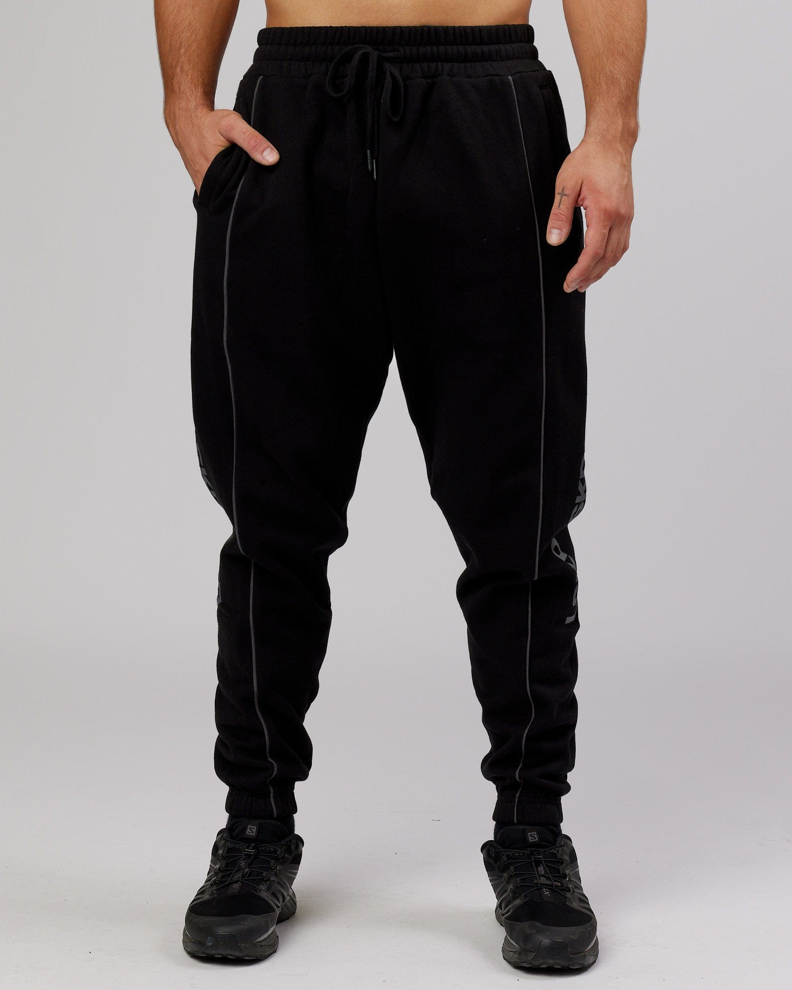 Model wearing Impact Trackpants - Black-Grey