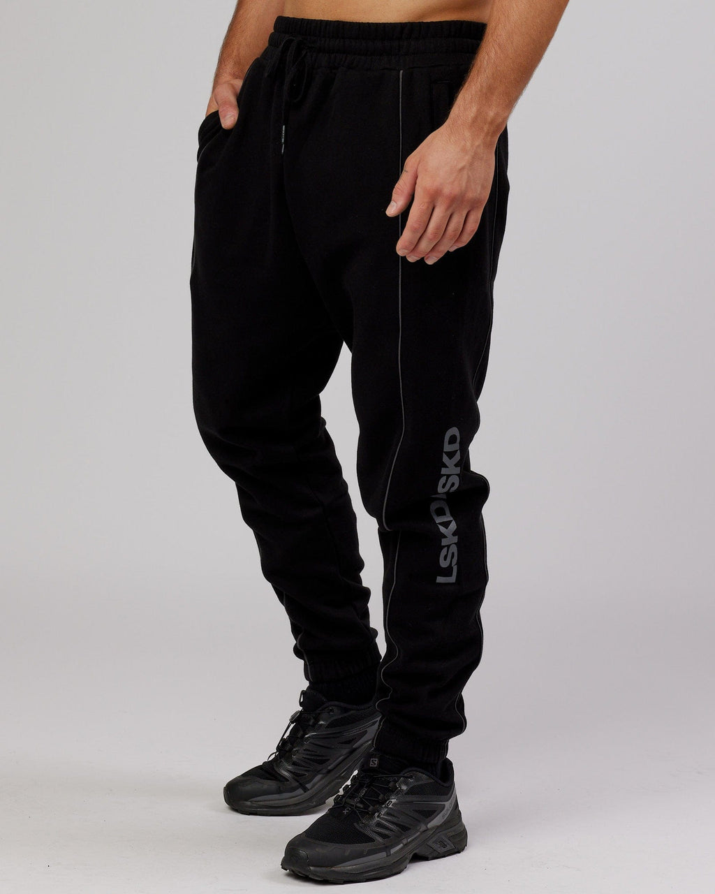 Model wearing Impact Trackpants - Black-Grey