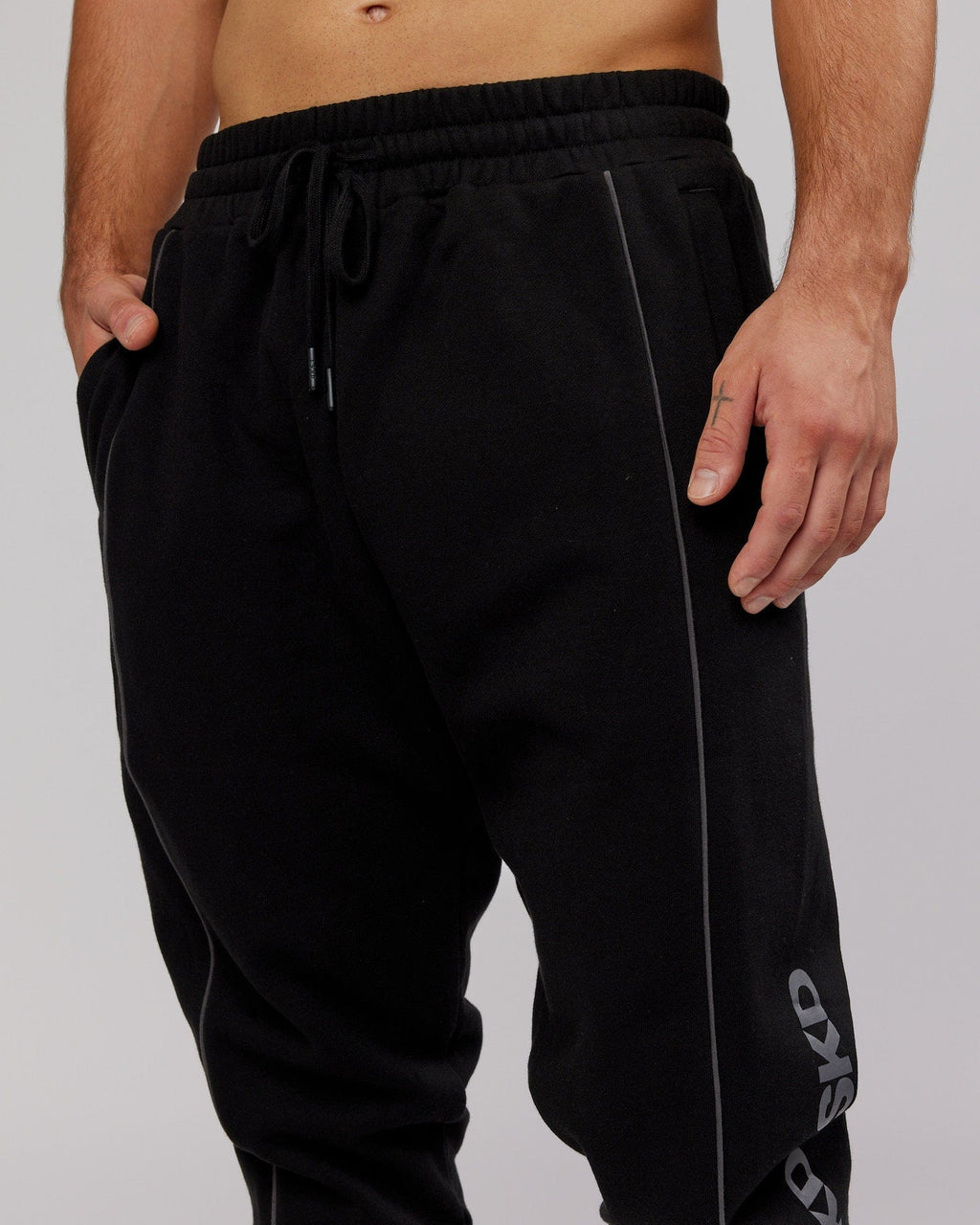 Model wearing Impact Trackpants - Black-Grey