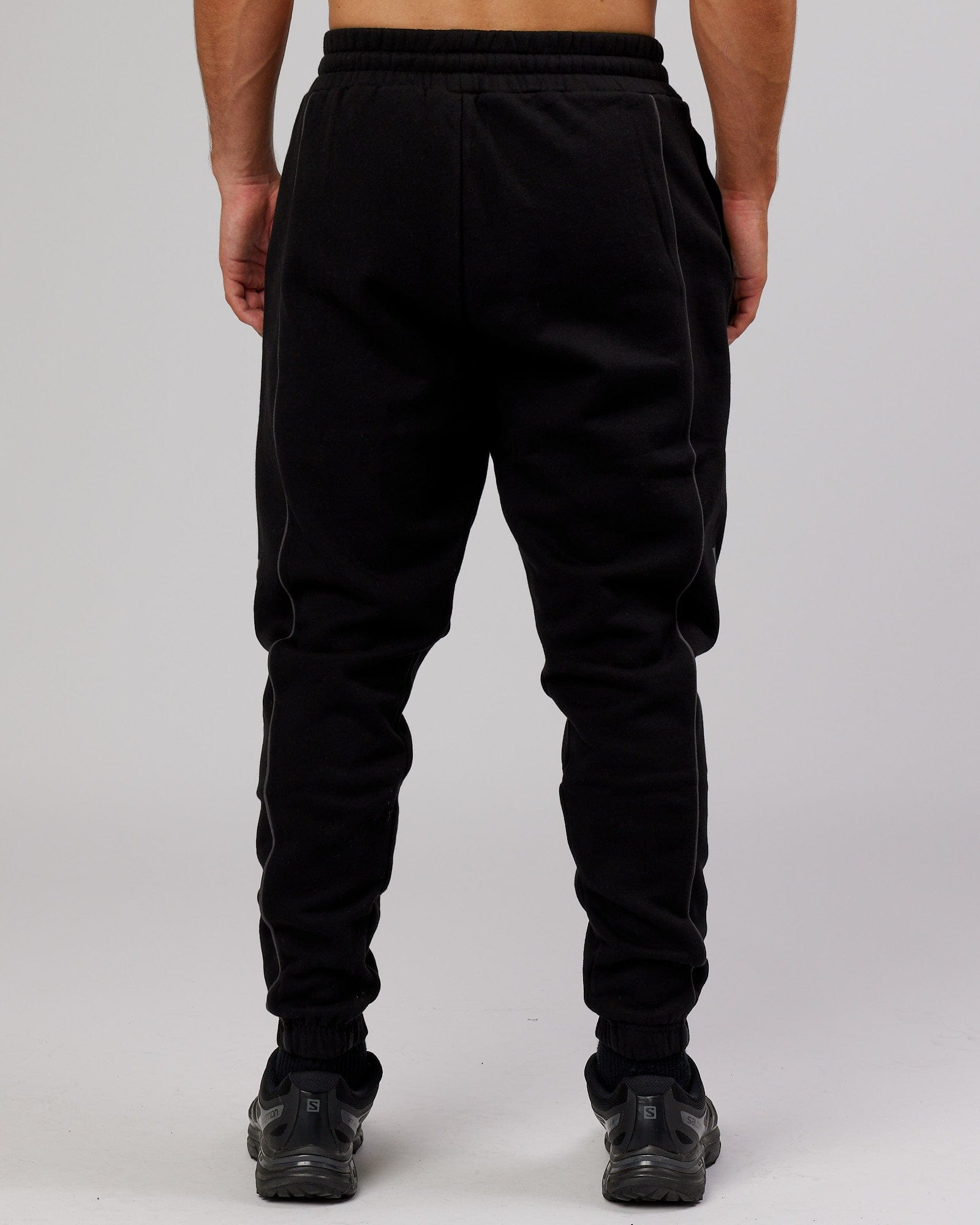 Model wearing Impact Trackpants - Black-Grey