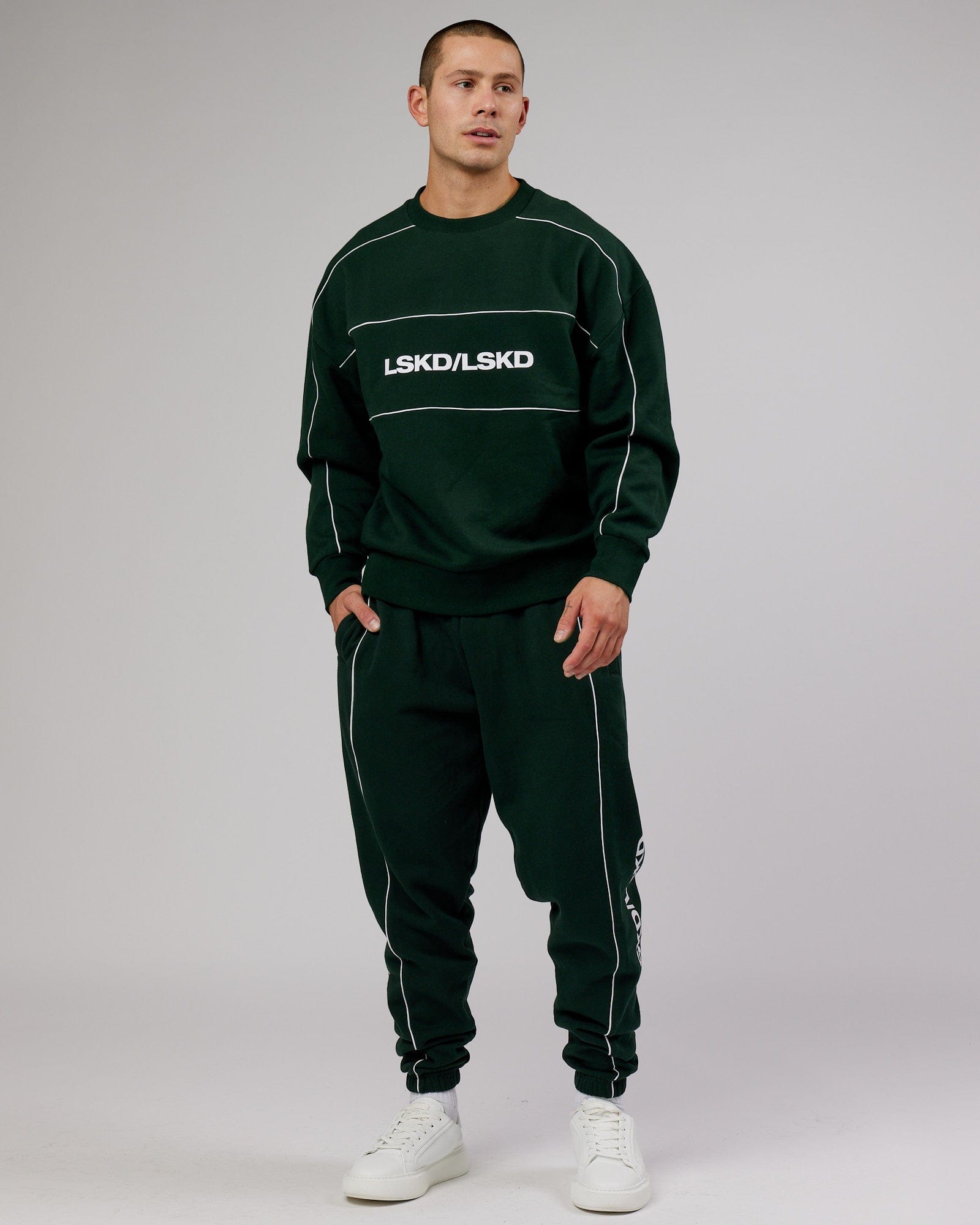 Model wearing Impact Trackpants - Forest
