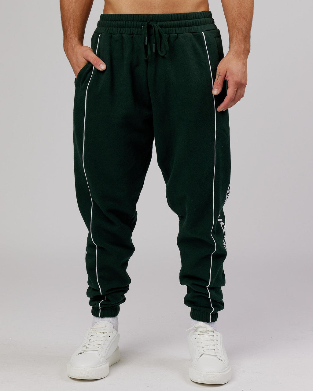 Model wearing Impact Trackpants - Forest