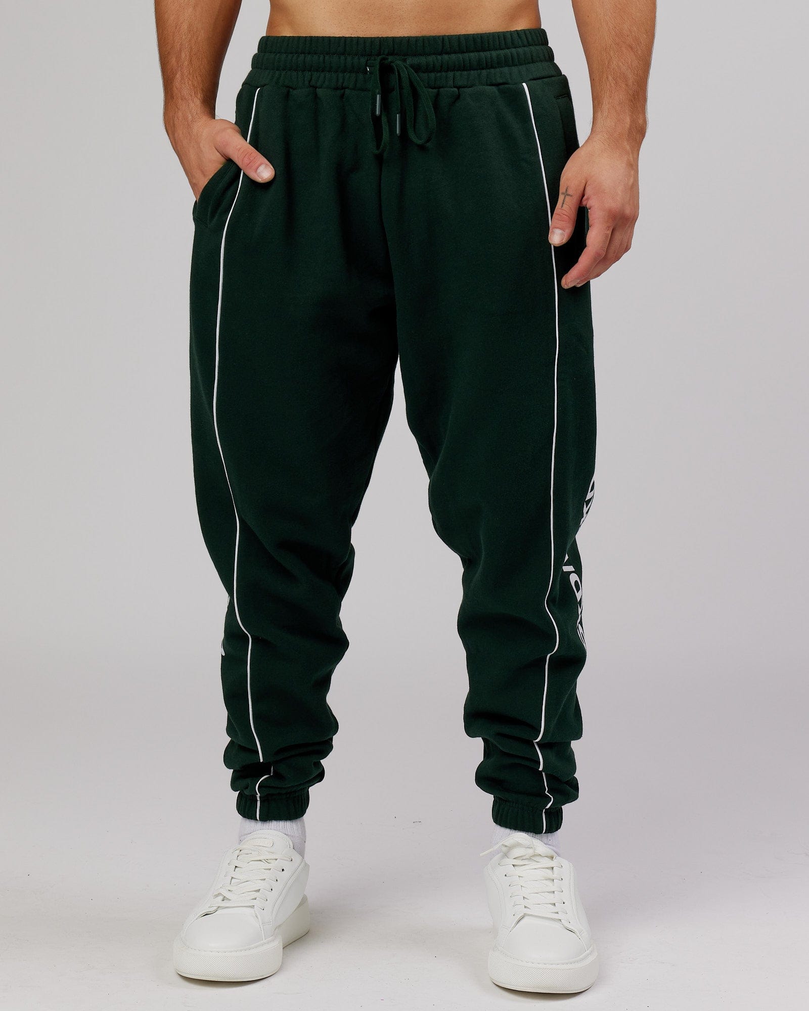 Model wearing Impact Trackpants - Forest