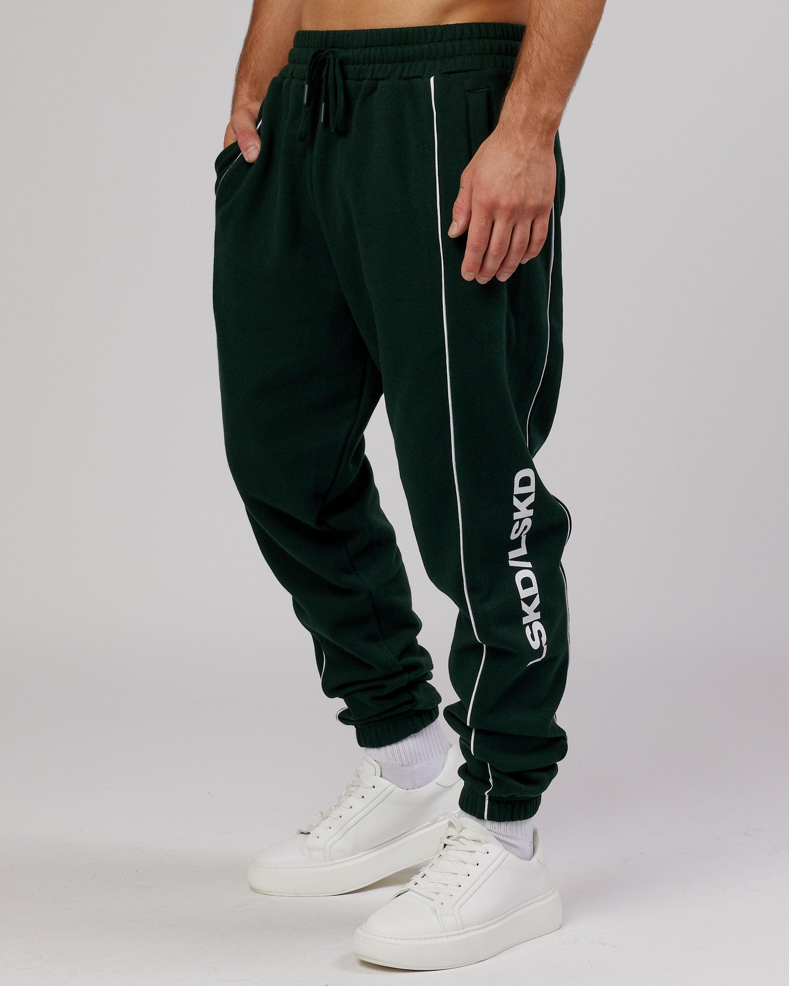Model wearing Impact Trackpants - Forest
