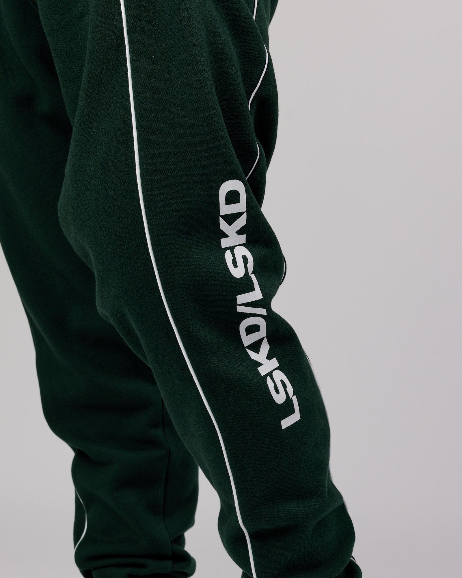 Model wearing Impact Trackpants - Forest