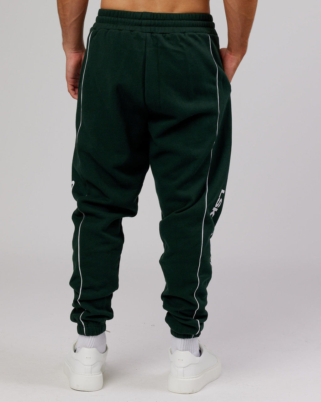 Model wearing Impact Trackpants - Forest