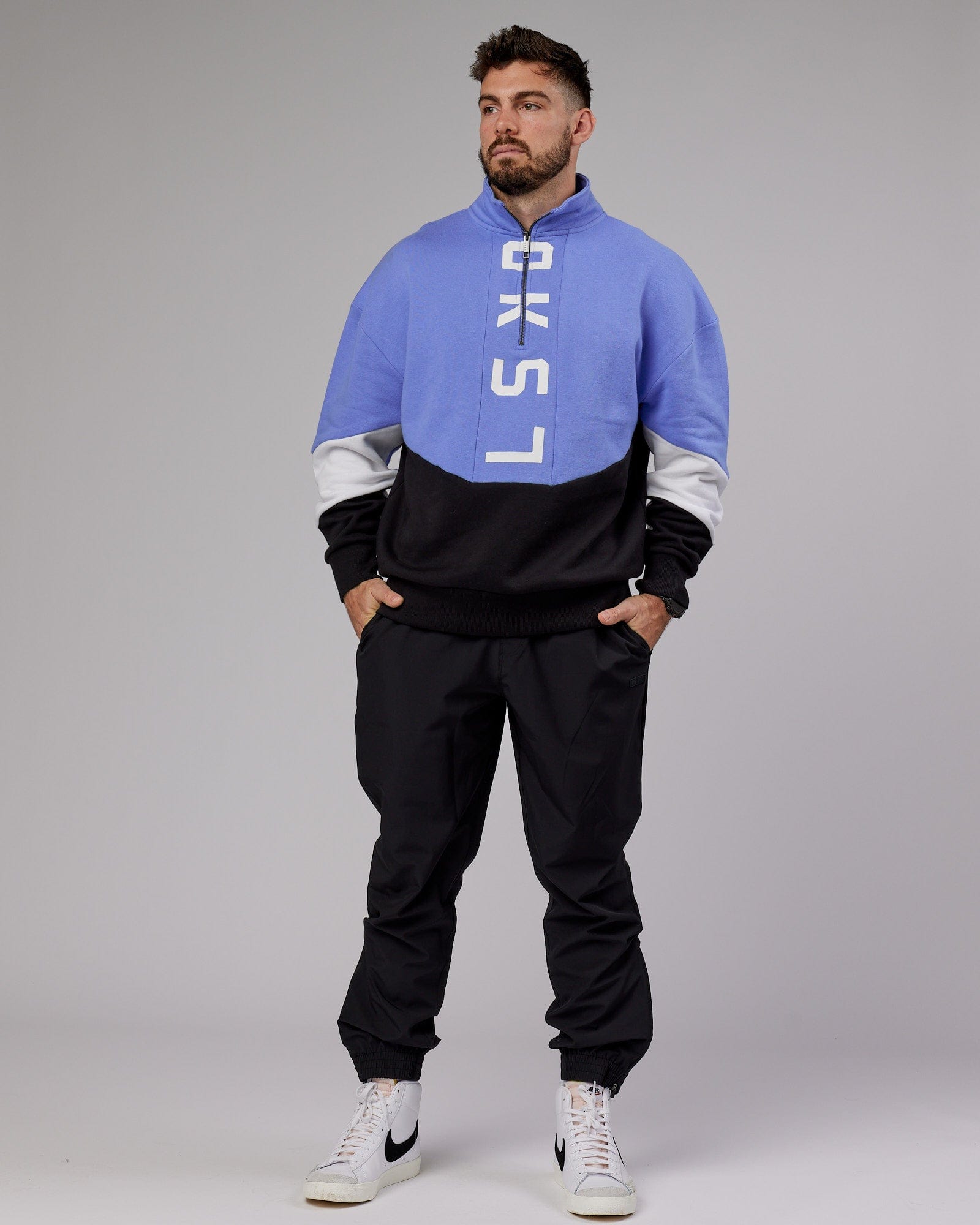 Model wearing Inversion Sweater Oversize - Cornflower Blue-Black