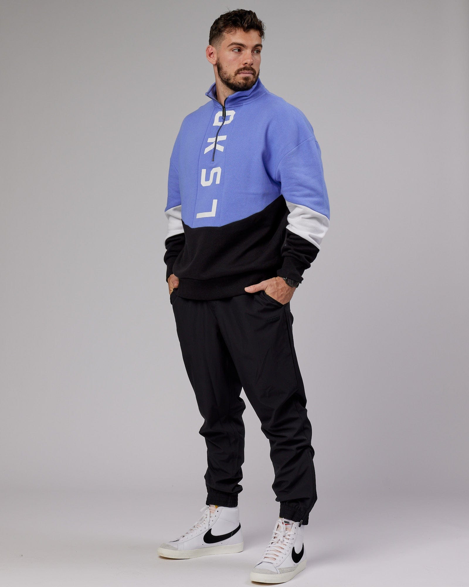 Model wearing Inversion Sweater Oversize - Cornflower Blue-Black