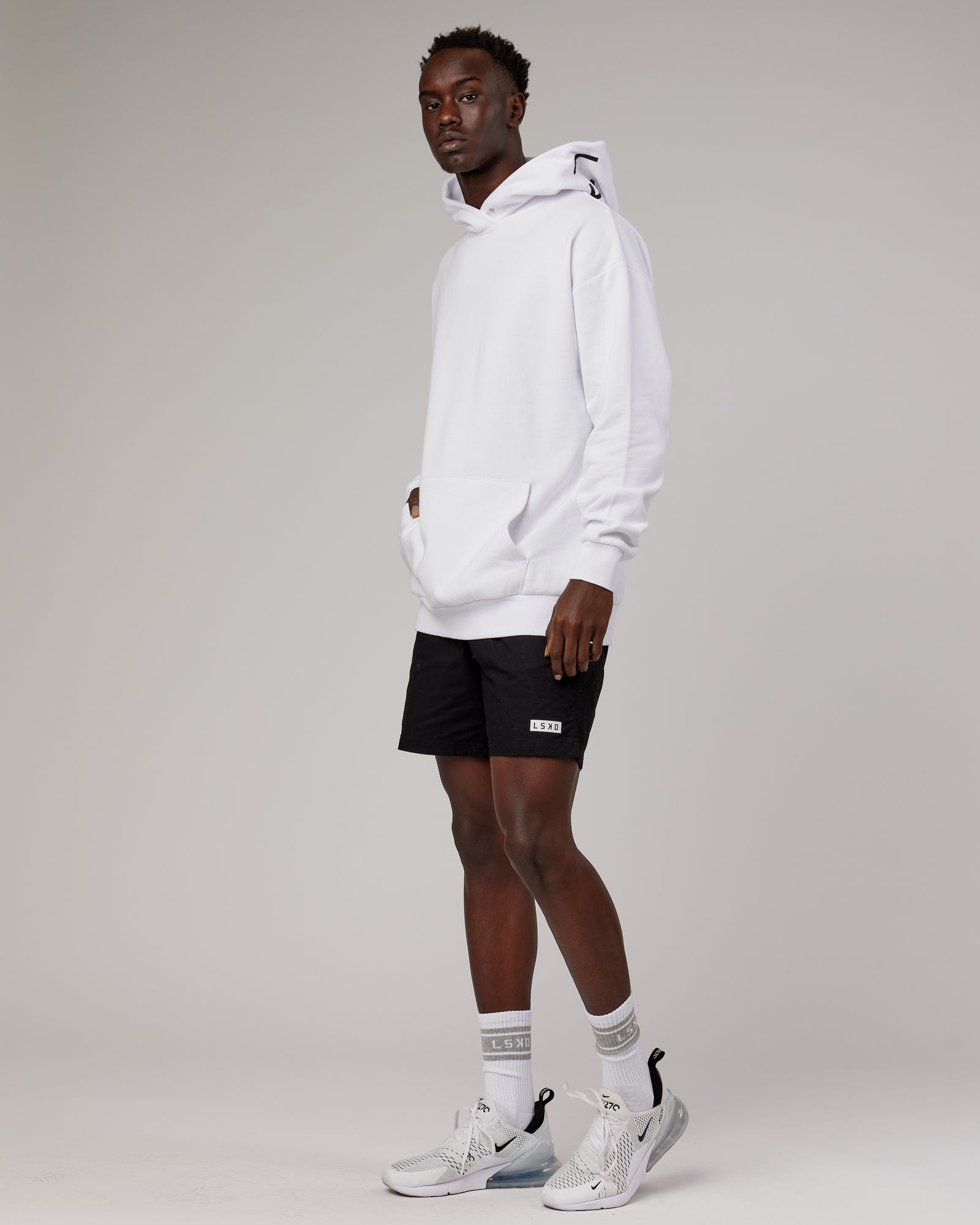 Model wearing Linear Hoodie Oversize - White