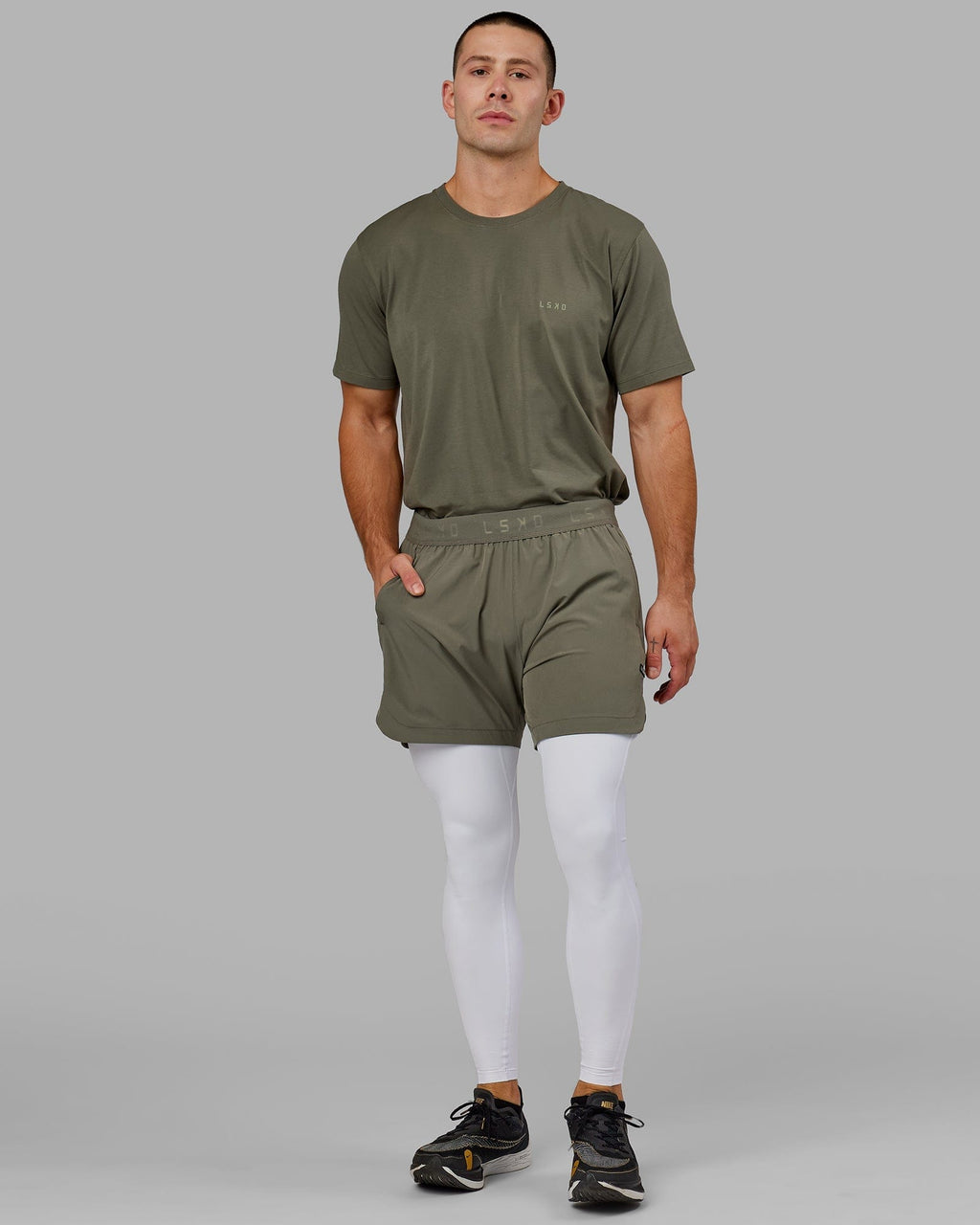 Model wearing Men's Perform Full Length Tight - White