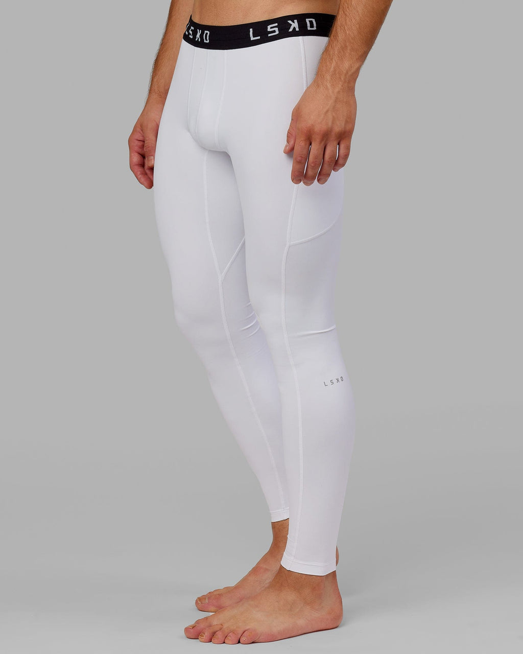 Model wearing Men's Perform Full Length Tight - White