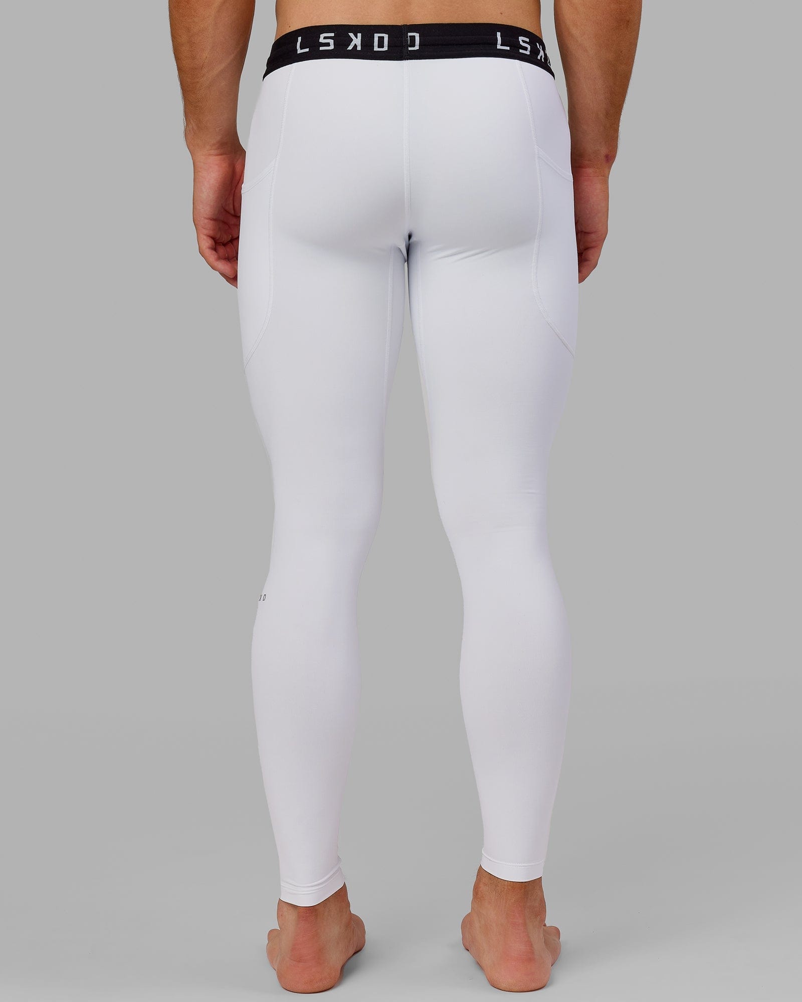 Model wearing Men's Perform Full Length Tight - White