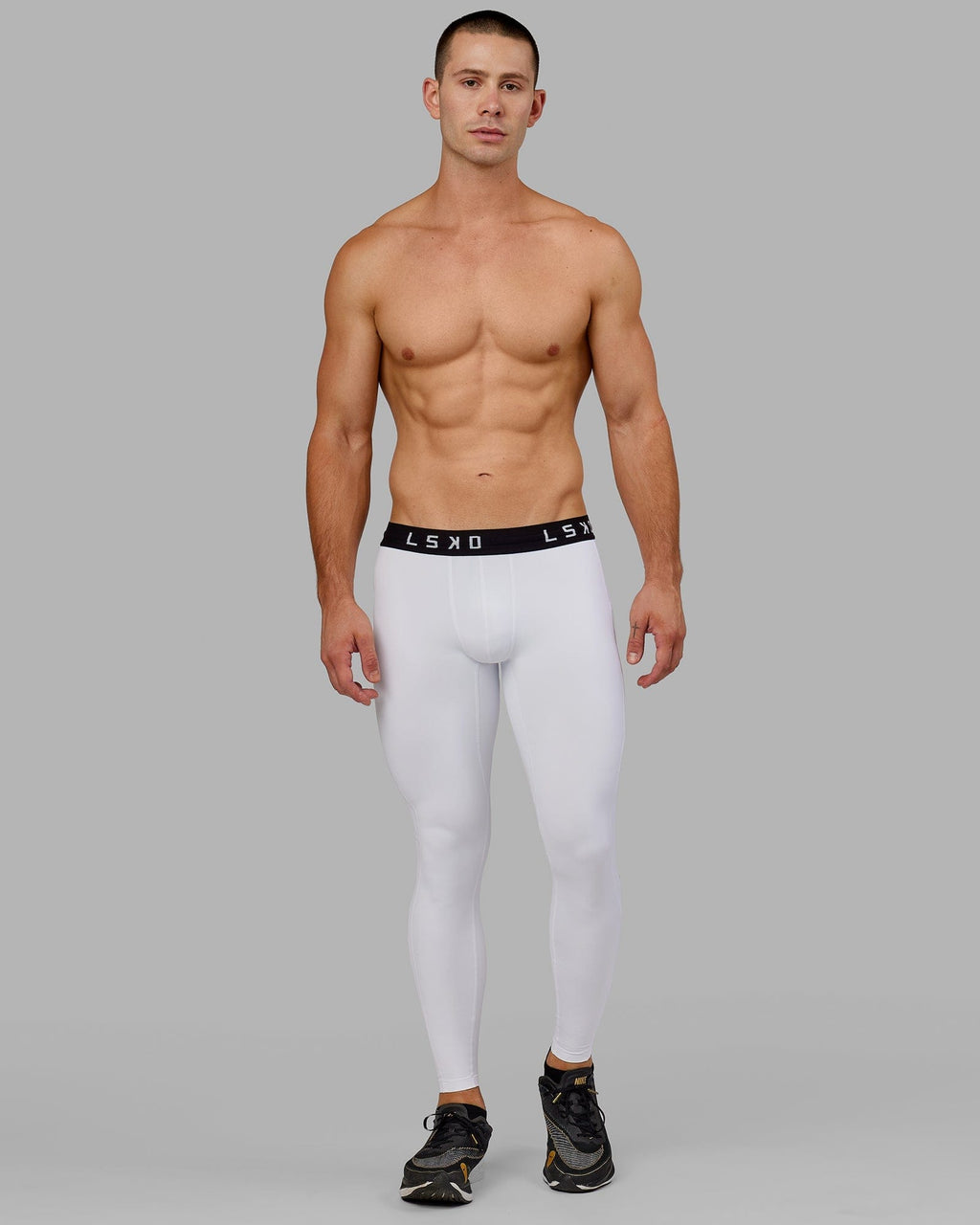 Model wearing Men's Perform Full Length Tight - White