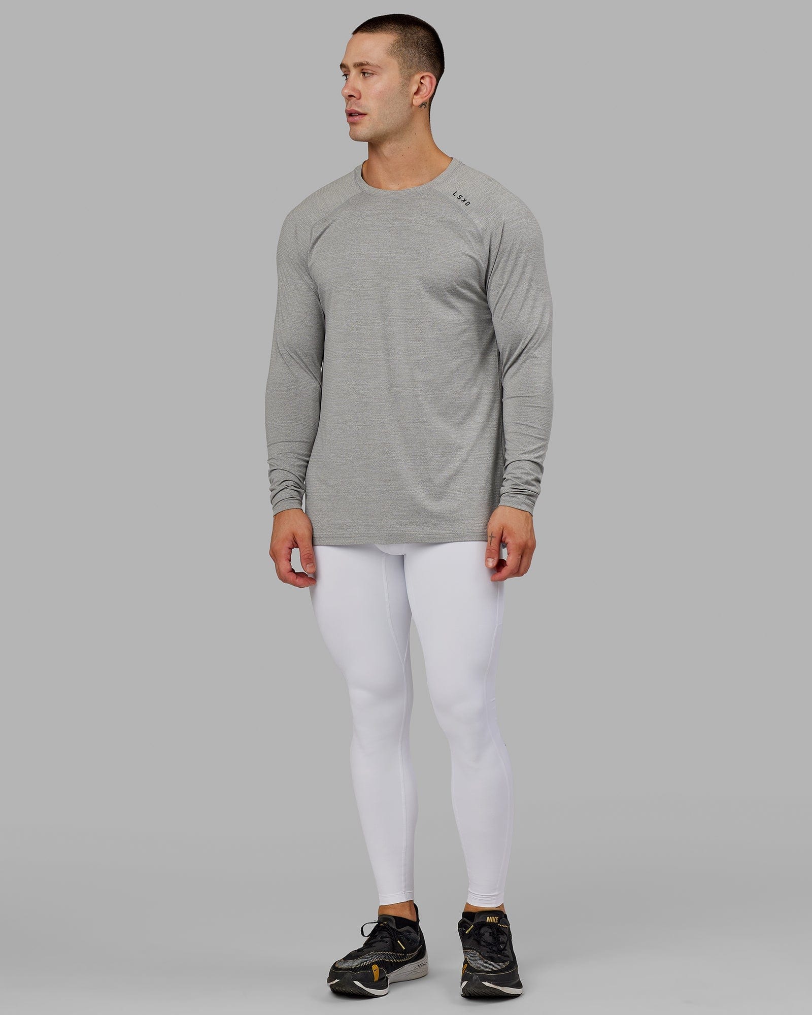 Model wearing Men's Perform Full Length Tight - White