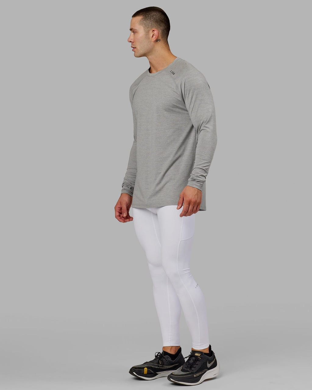 Model wearing Men's Perform Full Length Tight - White