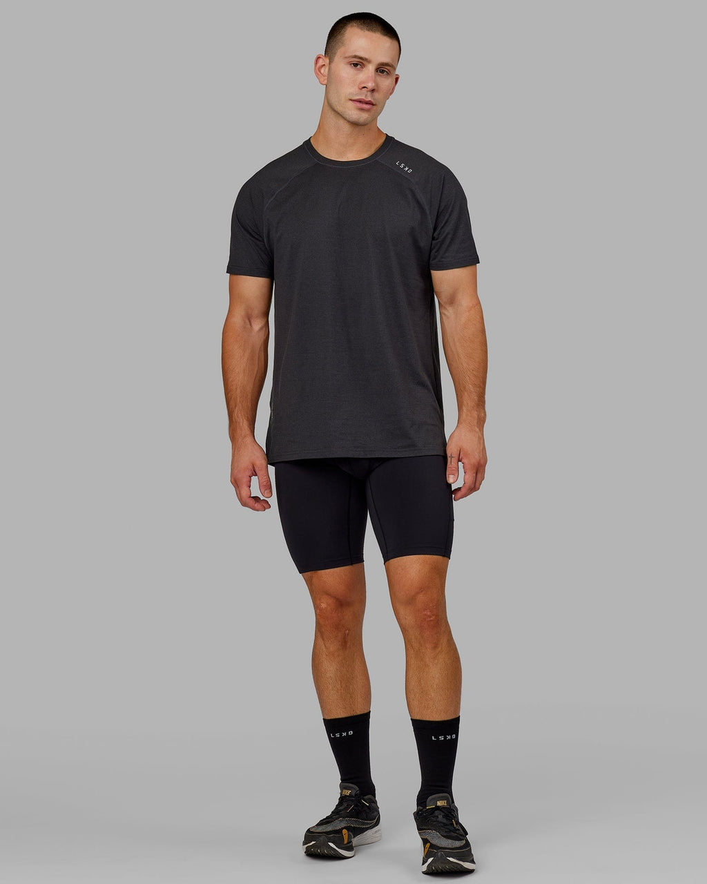 Model wearing Men's Perform Short Tight - Black