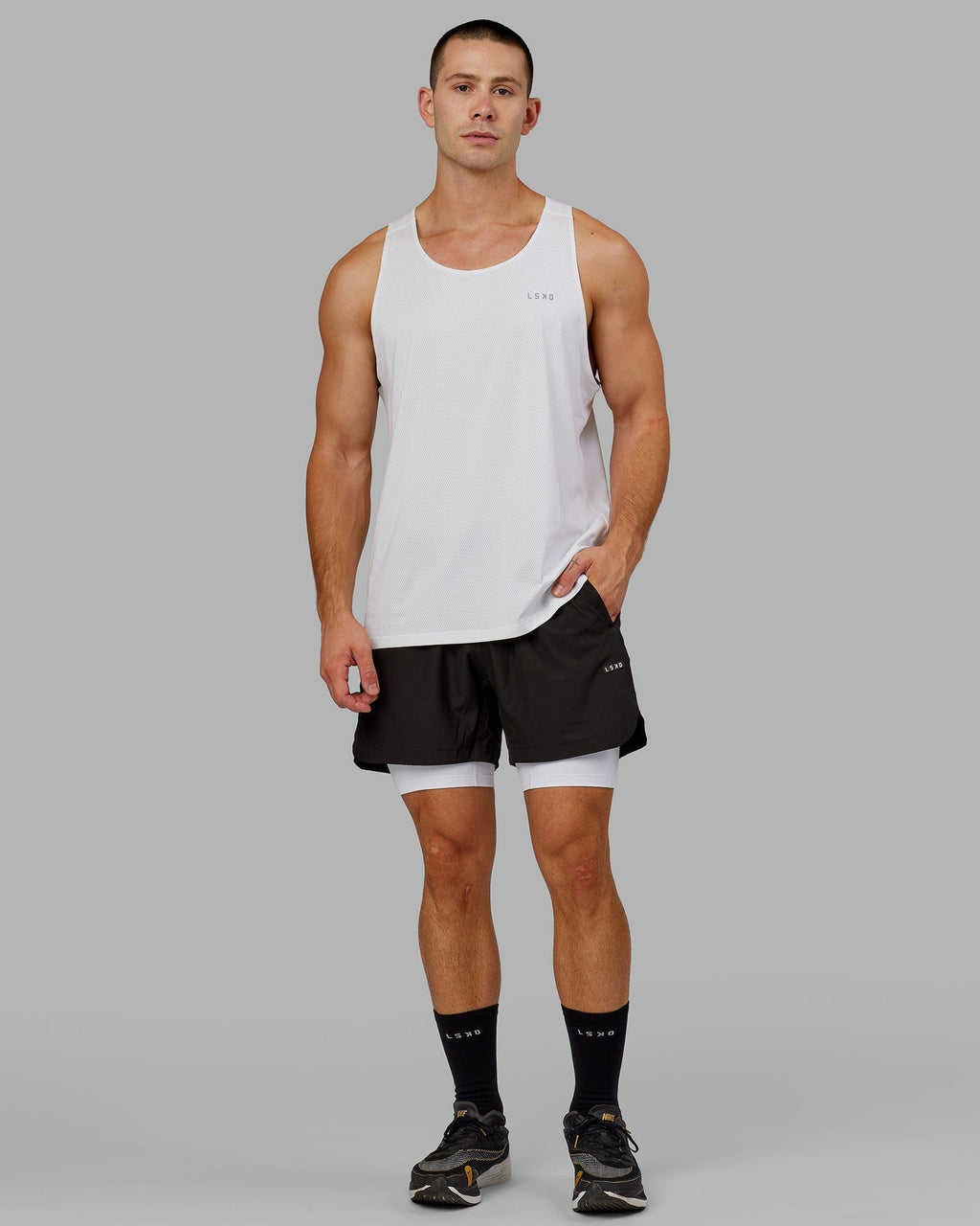 Model wearing Men's Perform Short Tight - White