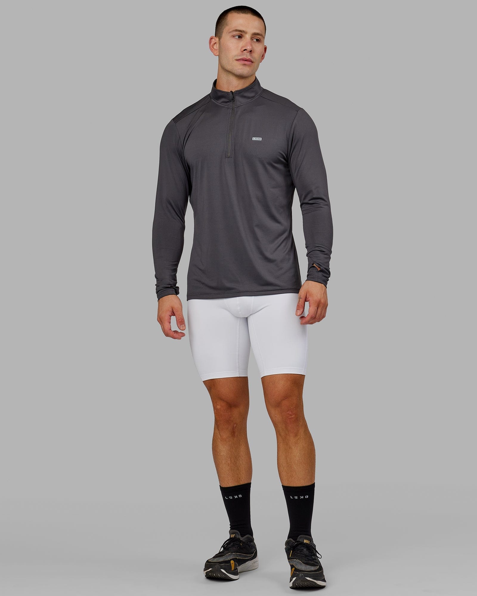 Model wearing Men's Perform Short Tight - White