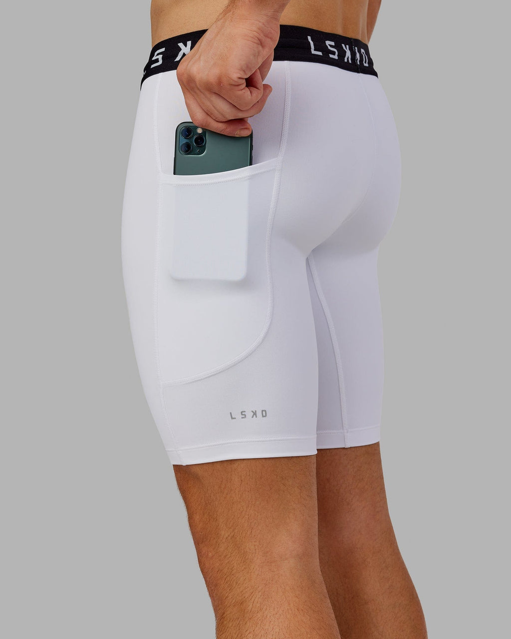 Model wearing Men's Perform Short Tight - White