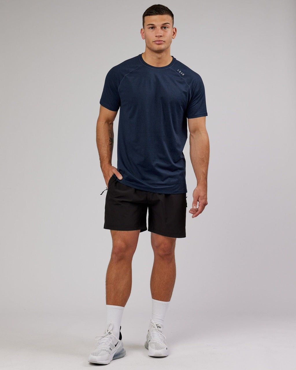 Model wearing Perform VapourFLX Tee - Navy Marl