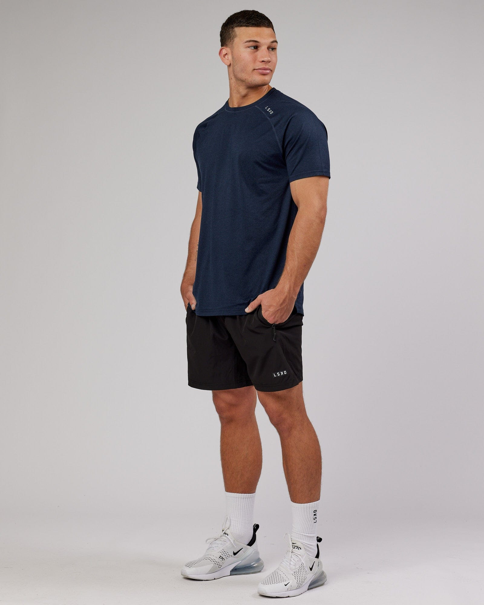 Model wearing Perform VapourFLX Tee - Navy Marl