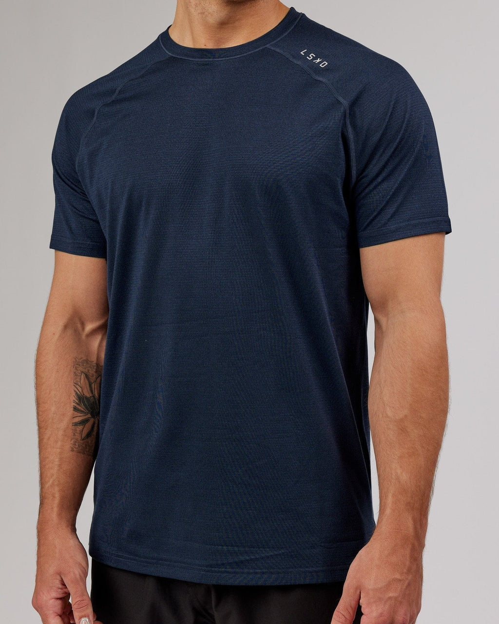 Model wearing Perform VapourFLX Tee - Navy Marl