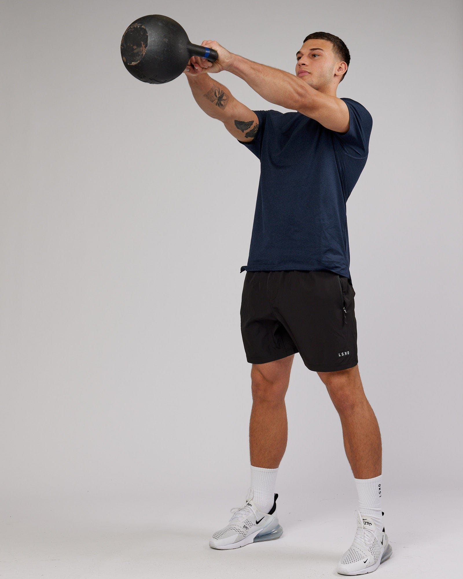 Model wearing Perform VapourFLX Tee - Navy Marl