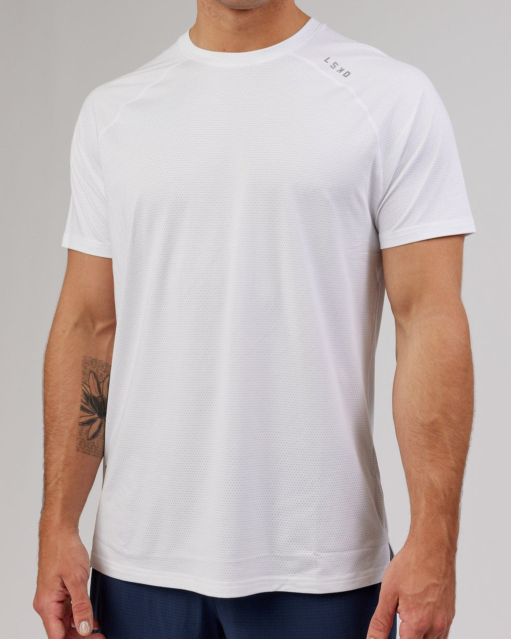 Model wearing Perform VapourFLX Tee - White Marl