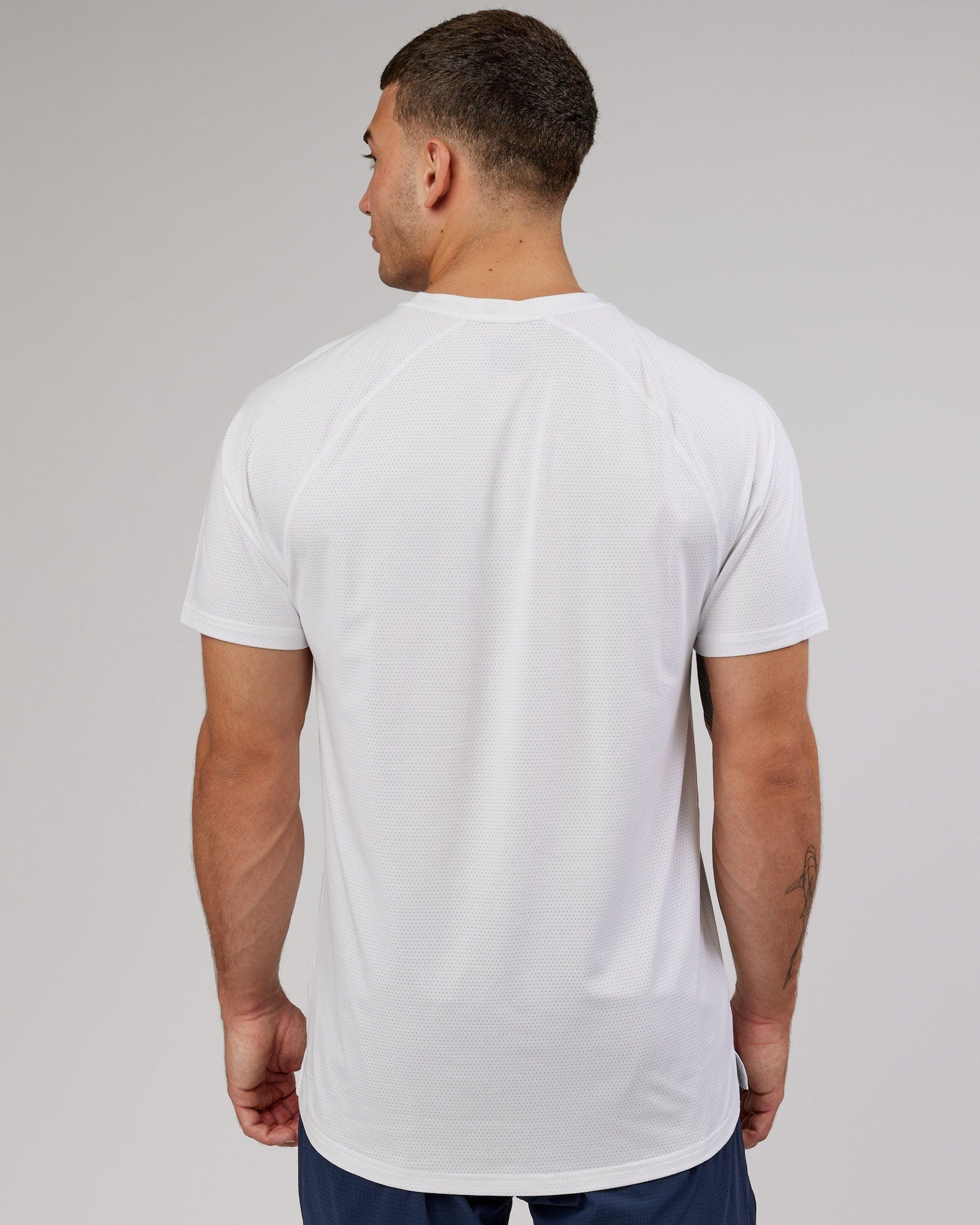 Model wearing Perform VapourFLX Tee - White Marl