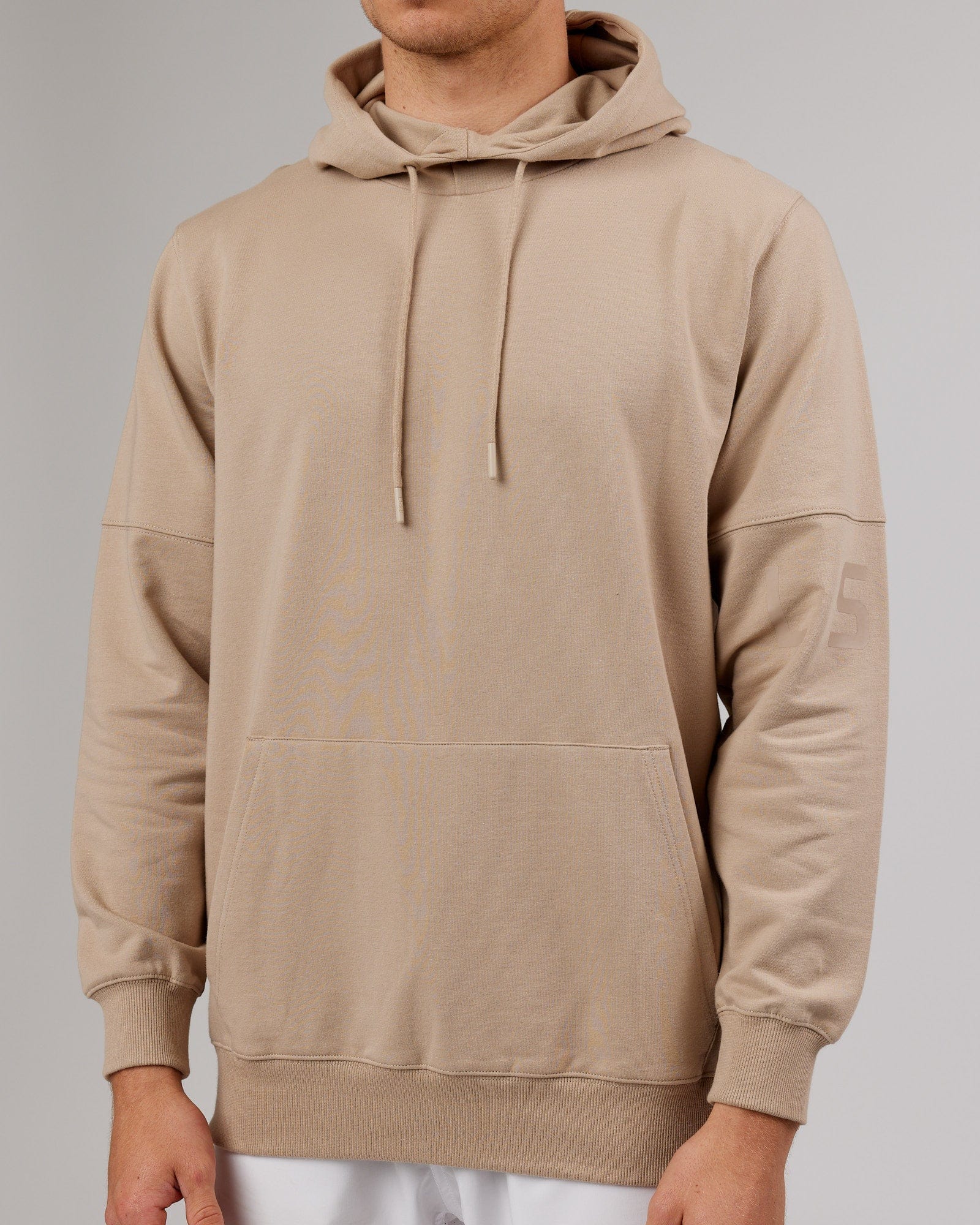 Model wearing Perimeter FLXFleece Hoodie - Taupe