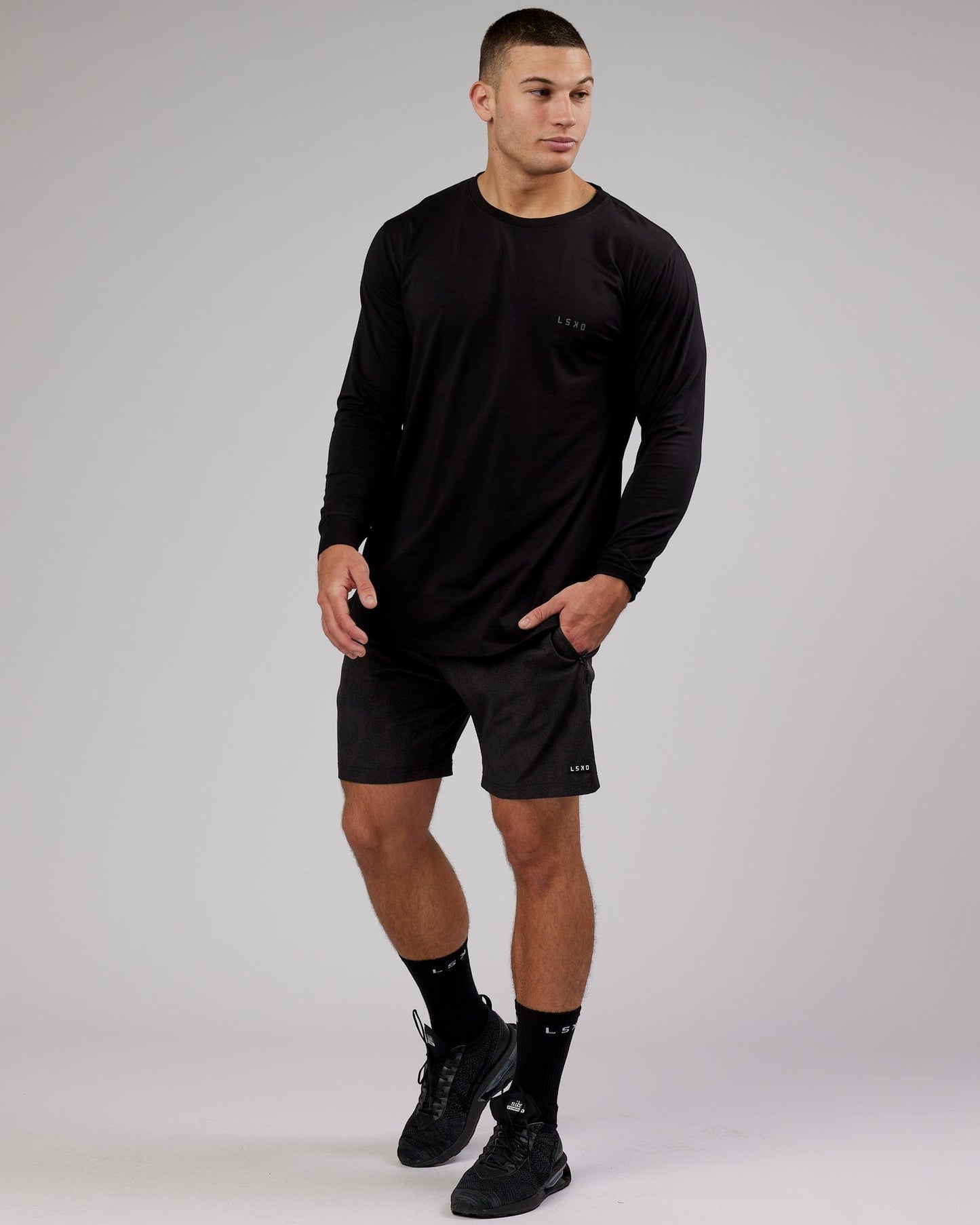 Model wearing Deluxe PimaFLX LS Tee - Black