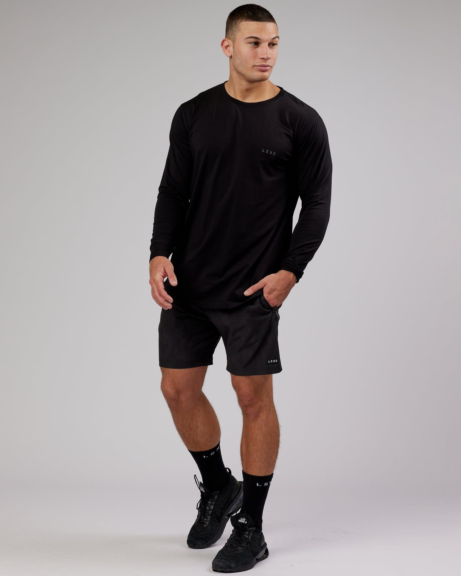 Model wearing Deluxe PimaFLX LS Tee - Black