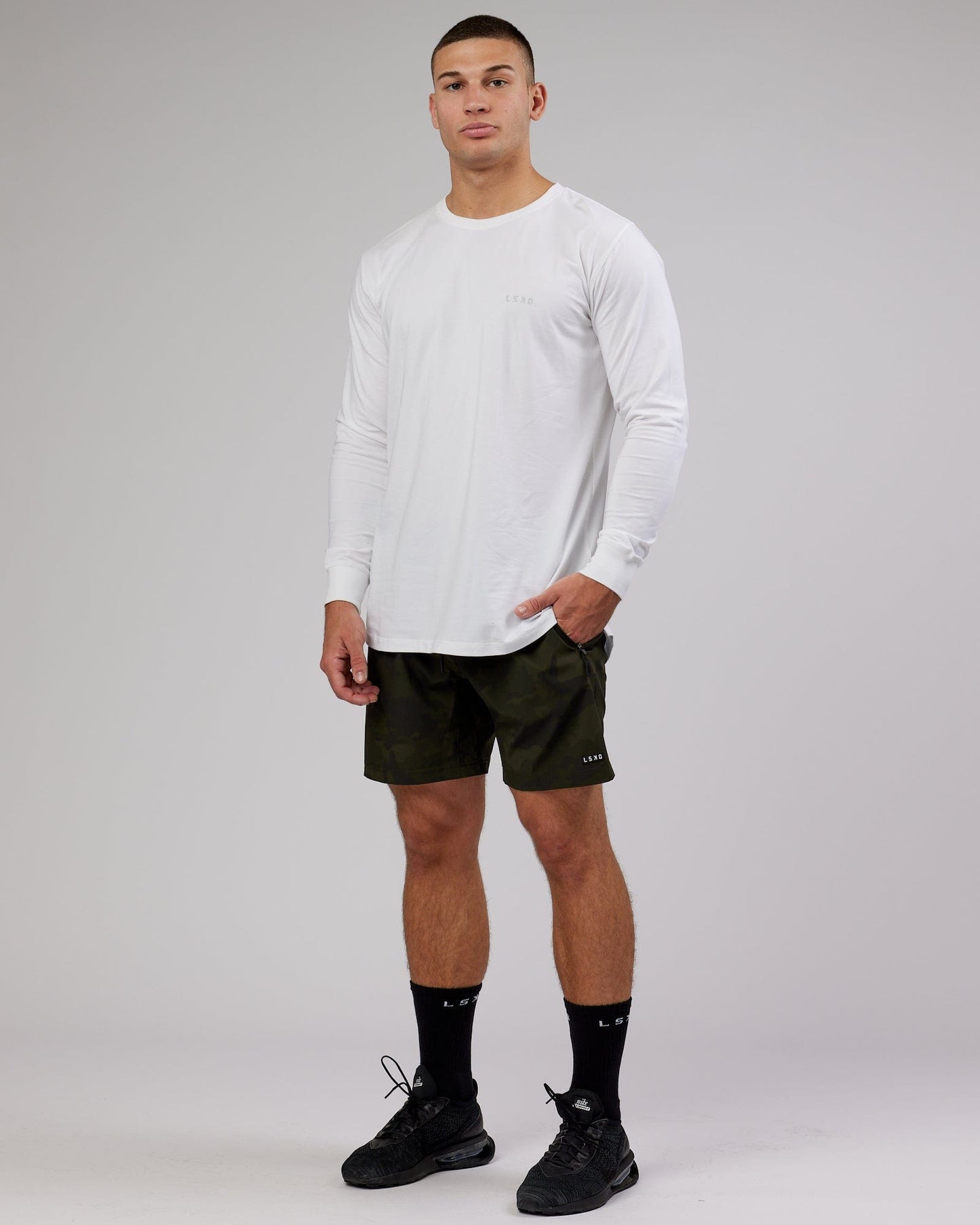 Model wearing Deluxe PimaFLX LS Tee - White