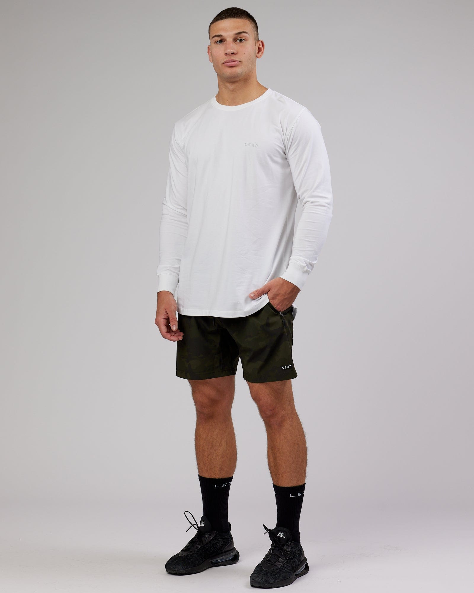 Model wearing Deluxe PimaFLX LS Tee - White