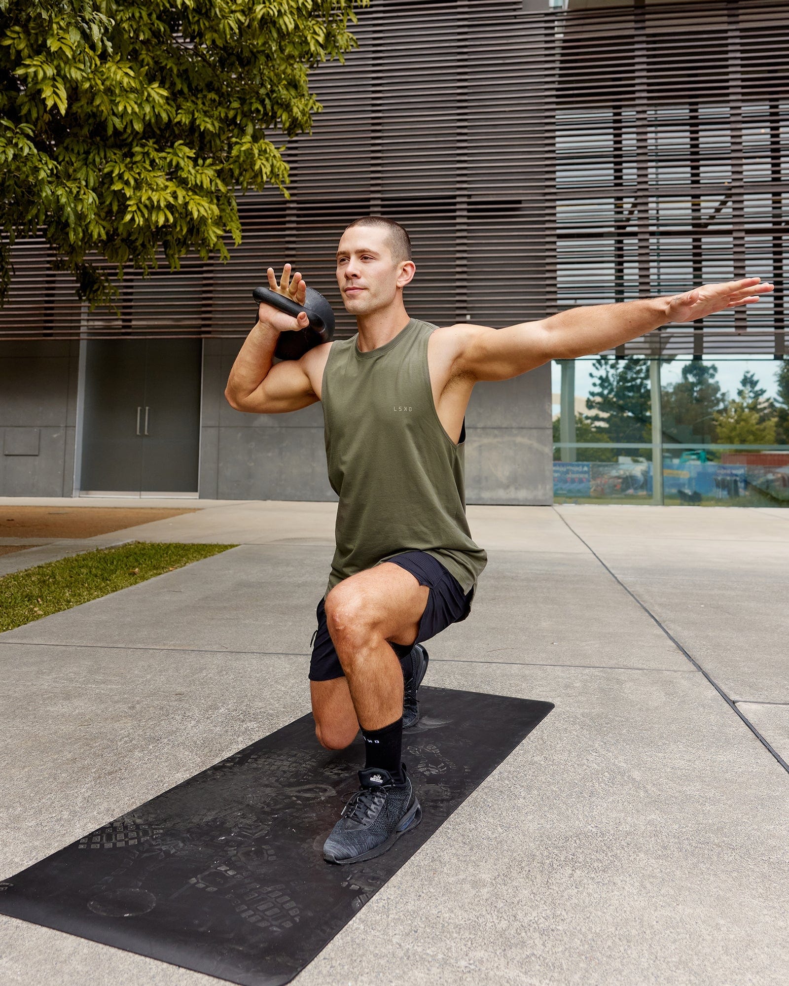 Model wearing Deluxe PimaFLX Tank - Olive Fade