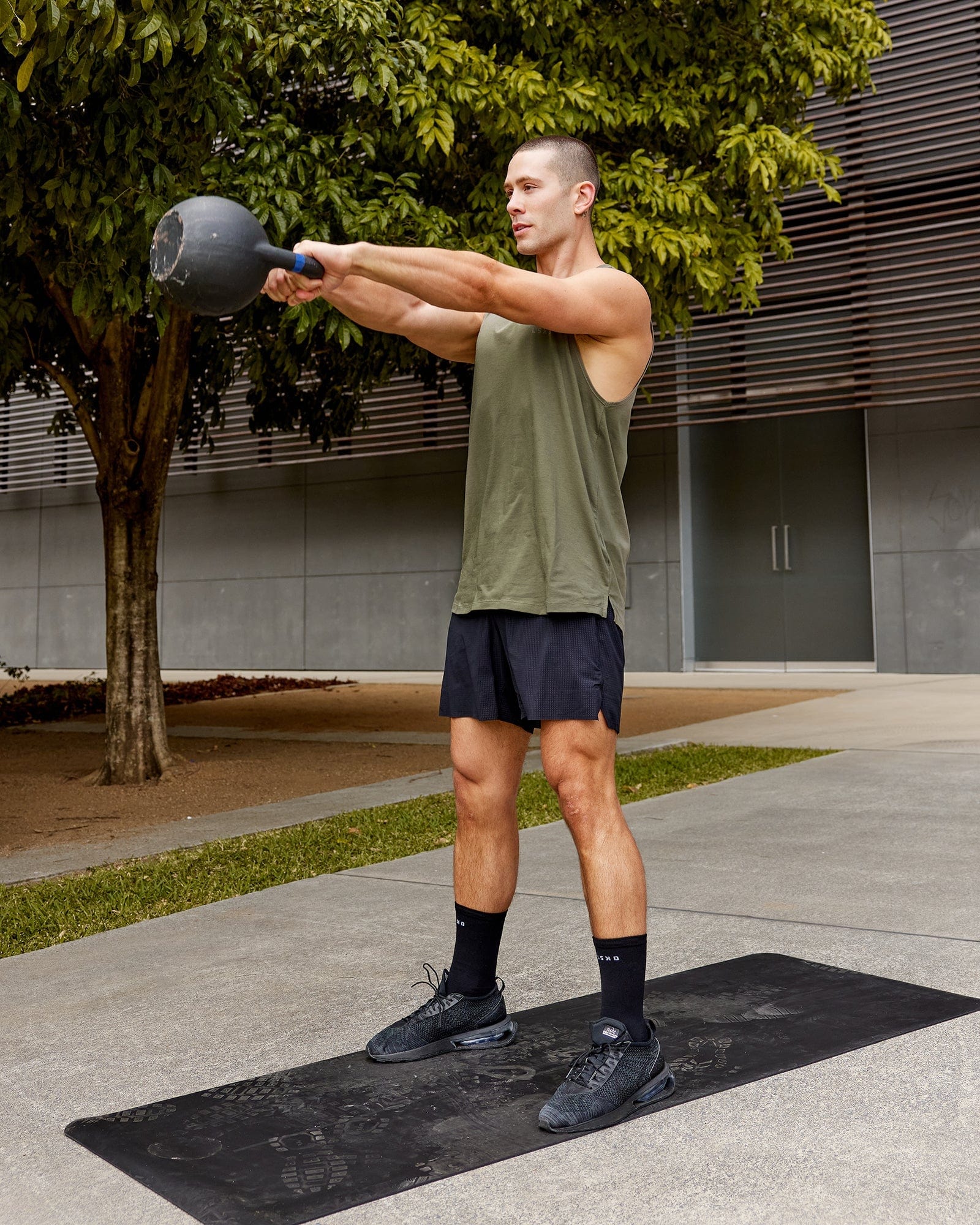 Model wearing Deluxe PimaFLX Tank - Olive Fade