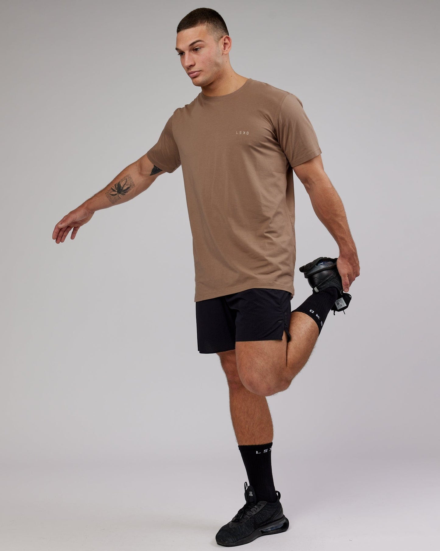 Model wearing Deluxe PimaFLX Tee - Fossil