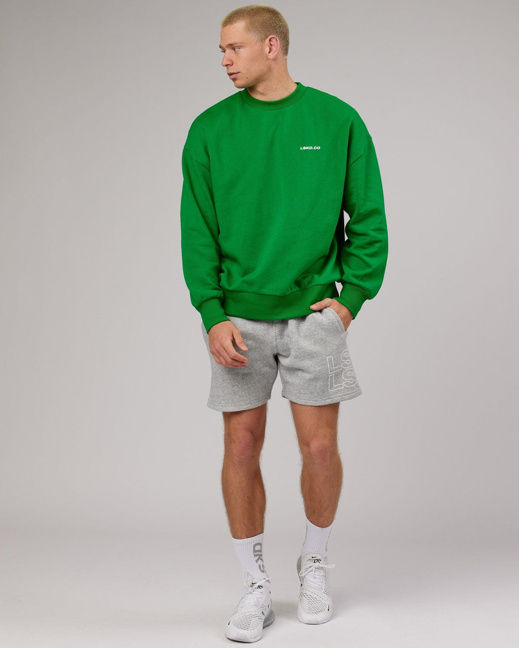 Model wearing Revolutions Oversize Sweater - Vivid Green