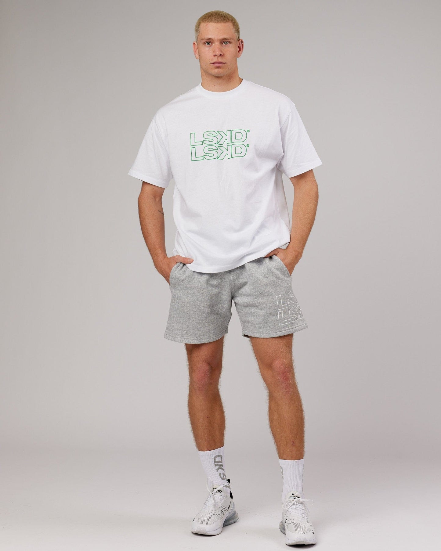Model wearing Stacks Up Heavyweight Oversize Tee - White-Vivid Green