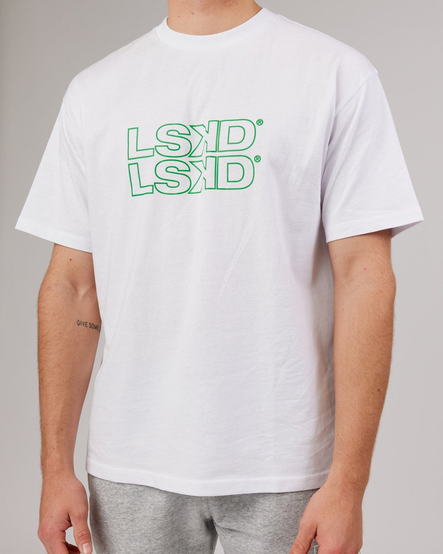 Model wearing Stacks Up Heavyweight Oversize Tee - White-Vivid Green