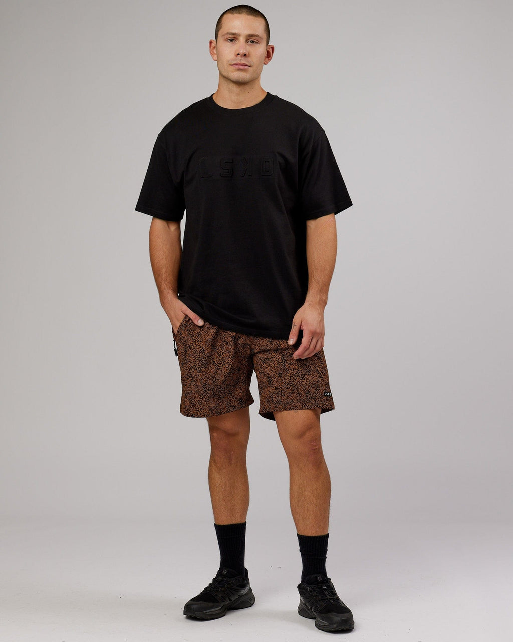 Model wearing Unisex Stamped Heavyweight Tee Oversize - Black