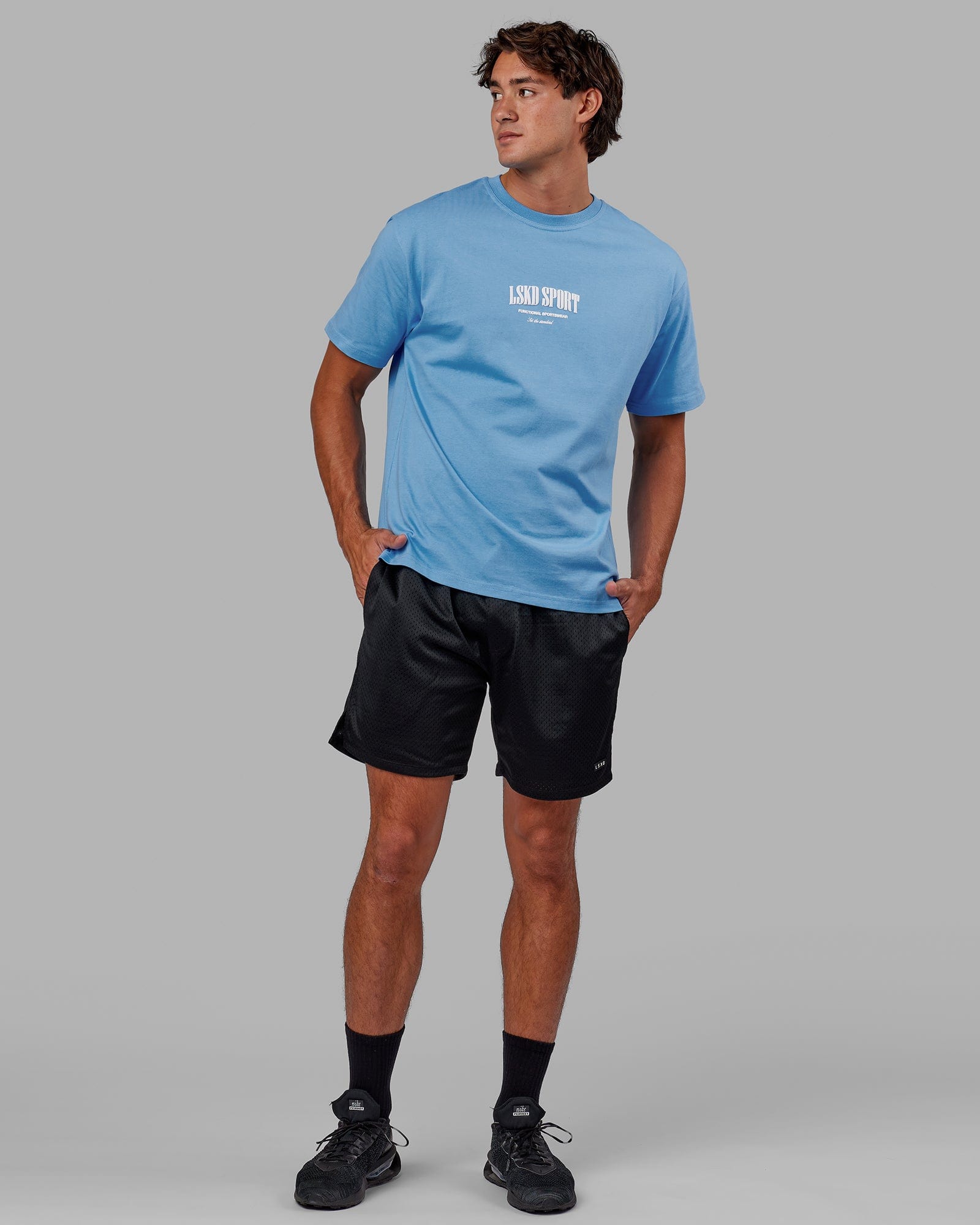 Model wearing Standard Heavyweight Tee Oversize - Azure Blue