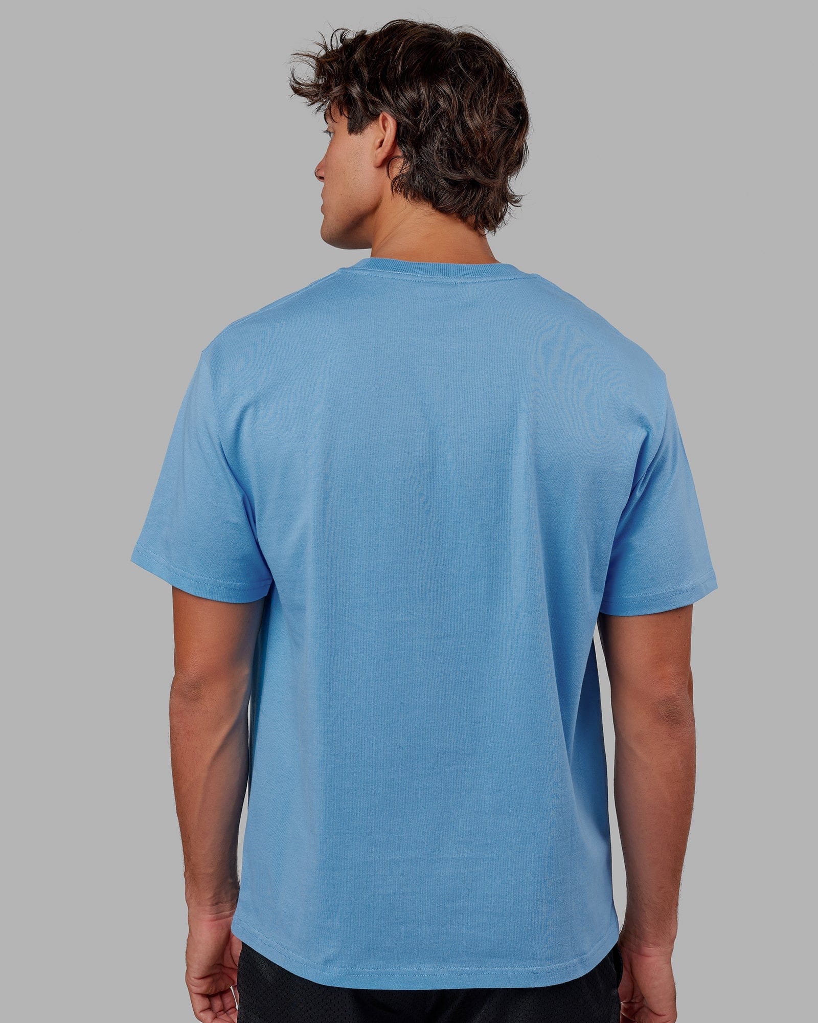 Model wearing Standard Heavyweight Tee Oversize - Azure Blue
