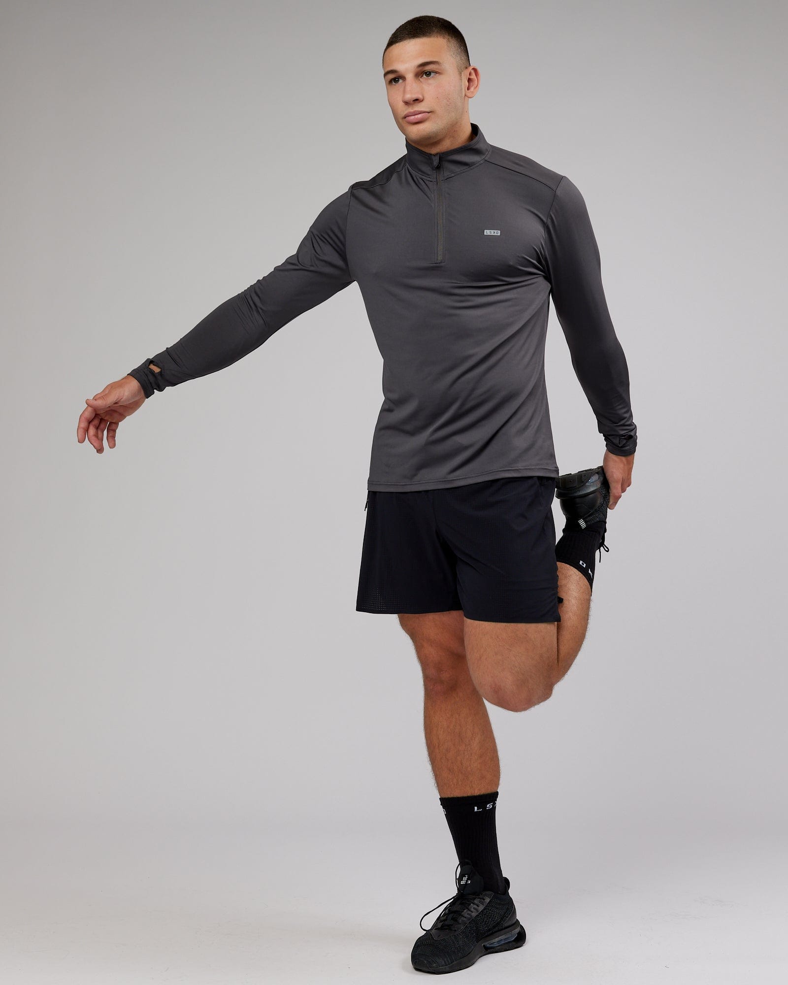 Model wearing Streamlined 1/4 Zip Active LS Top - Asphalt